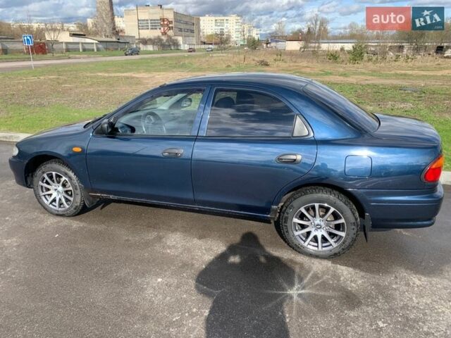 Синій Мазда 323, об'ємом двигуна 1.5 л та пробігом 240 тис. км за 2700 $, фото 1 на Automoto.ua