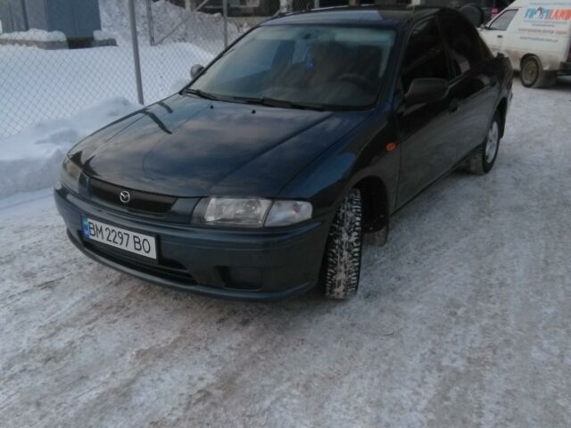 Синий Мазда 323, объемом двигателя 1.5 л и пробегом 270 тыс. км за 3600 $, фото 1 на Automoto.ua