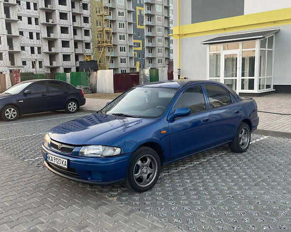 Синий Мазда 323, объемом двигателя 1.5 л и пробегом 349 тыс. км за 3200 $, фото 1 на Automoto.ua