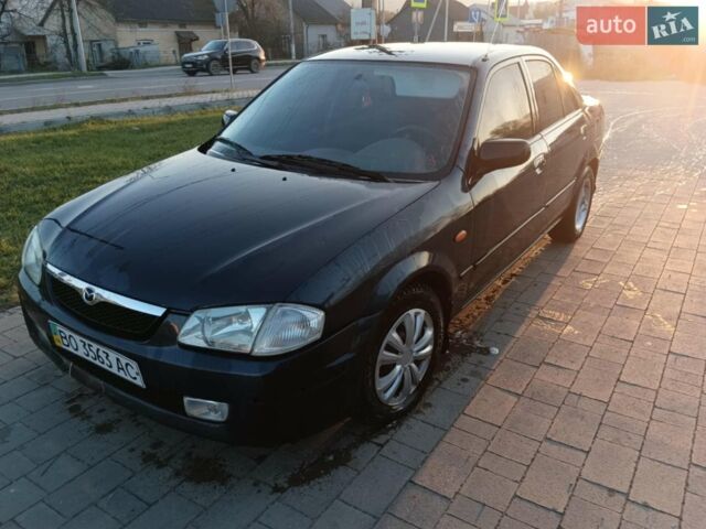 Синій Мазда 323, об'ємом двигуна 1.3 л та пробігом 222 тис. км за 2100 $, фото 1 на Automoto.ua