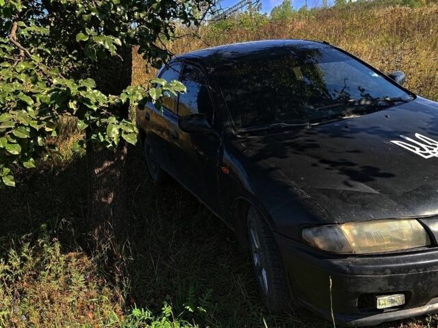 Синий Мазда 323, объемом двигателя 1 л и пробегом 245 тыс. км за 1083 $, фото 1 на Automoto.ua