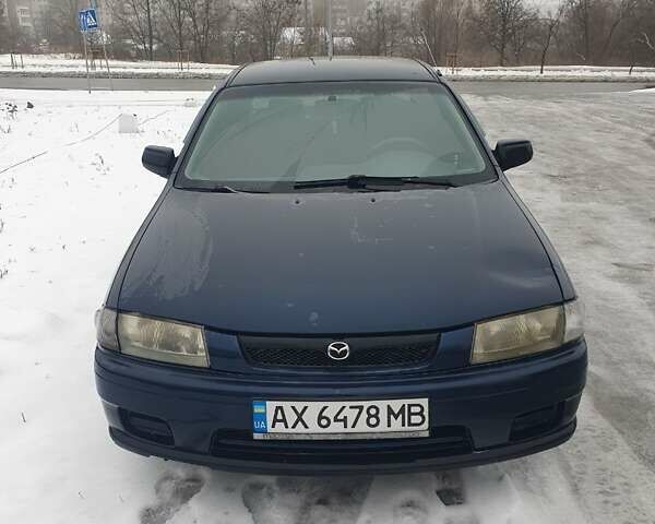 Синий Мазда 323, объемом двигателя 1.84 л и пробегом 299 тыс. км за 2000 $, фото 1 на Automoto.ua
