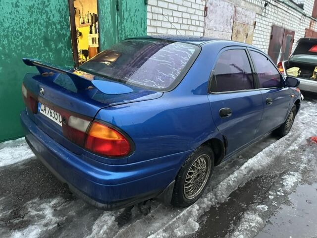 Синий Мазда 323, объемом двигателя 1.5 л и пробегом 1 тыс. км за 550 $, фото 1 на Automoto.ua