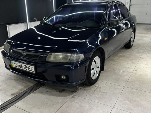 Синий Мазда 323, объемом двигателя 1.5 л и пробегом 200 тыс. км за 2004 $, фото 1 на Automoto.ua