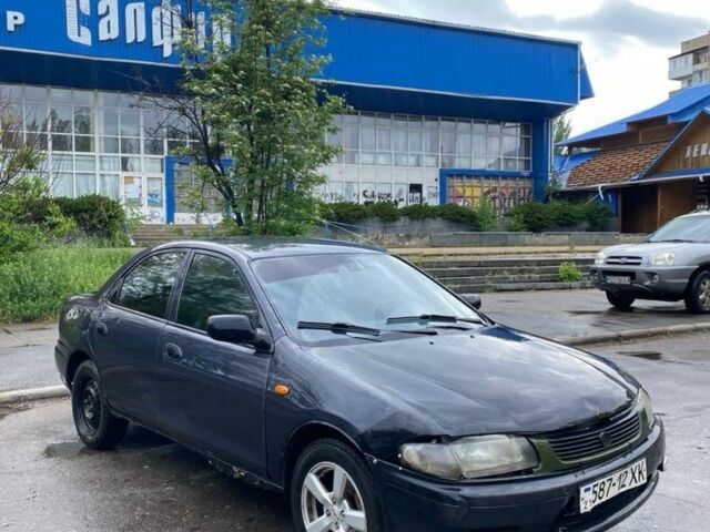 Синий Мазда 323, объемом двигателя 1.8 л и пробегом 200 тыс. км за 731 $, фото 1 на Automoto.ua