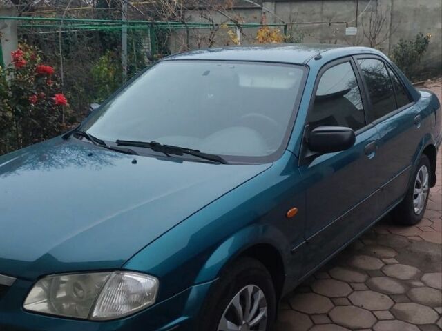 Синий Мазда 323, объемом двигателя 1.5 л и пробегом 280 тыс. км за 2700 $, фото 1 на Automoto.ua
