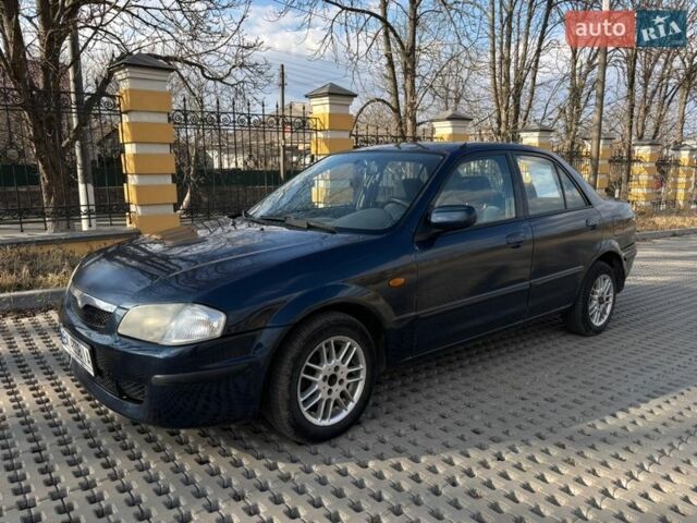 Синий Мазда 323, объемом двигателя 2 л и пробегом 310 тыс. км за 2000 $, фото 1 на Automoto.ua