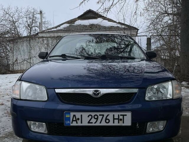 Синій Мазда 323, об'ємом двигуна 2 л та пробігом 390 тис. км за 3500 $, фото 1 на Automoto.ua