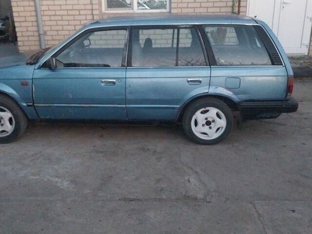 Синий Мазда 323, объемом двигателя 2 л и пробегом 300 тыс. км за 1100 $, фото 1 на Automoto.ua