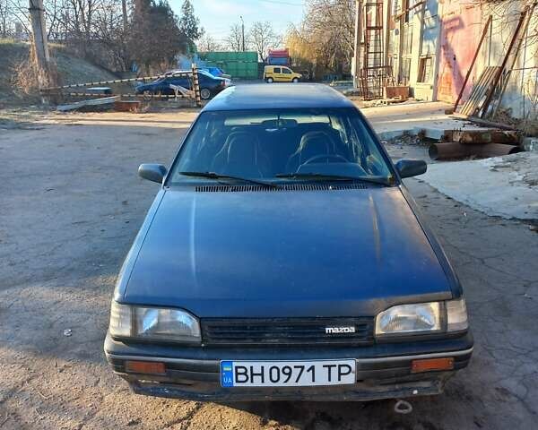 Синий Мазда 323, объемом двигателя 1.49 л и пробегом 314 тыс. км за 1000 $, фото 1 на Automoto.ua