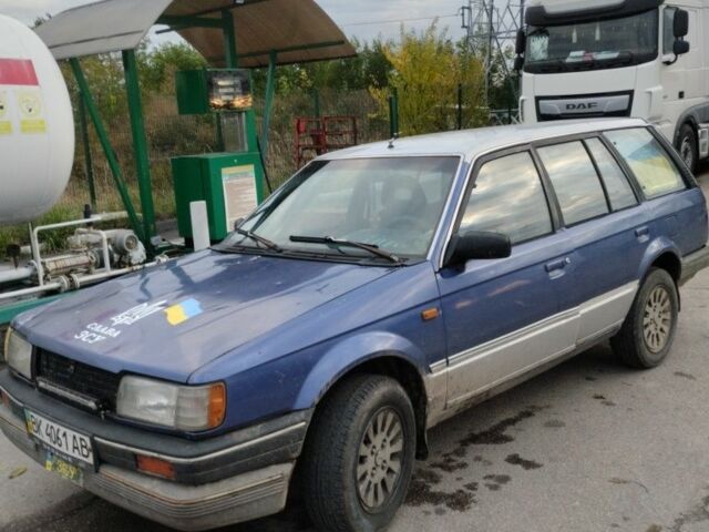 Синий Мазда 323, объемом двигателя 1.5 л и пробегом 100 тыс. км за 715 $, фото 1 на Automoto.ua