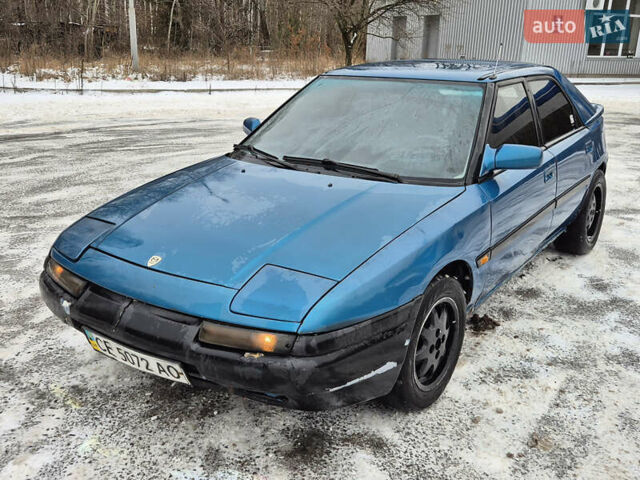 Синий Мазда 323, объемом двигателя 1.6 л и пробегом 195 тыс. км за 999 $, фото 1 на Automoto.ua