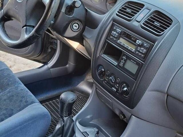 Синий Мазда 323, объемом двигателя 1.5 л и пробегом 275 тыс. км за 2500 $, фото 1 на Automoto.ua