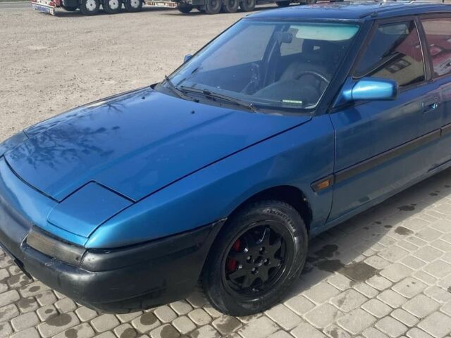 Синий Мазда 323, объемом двигателя 1 л и пробегом 357 тыс. км за 1500 $, фото 1 на Automoto.ua