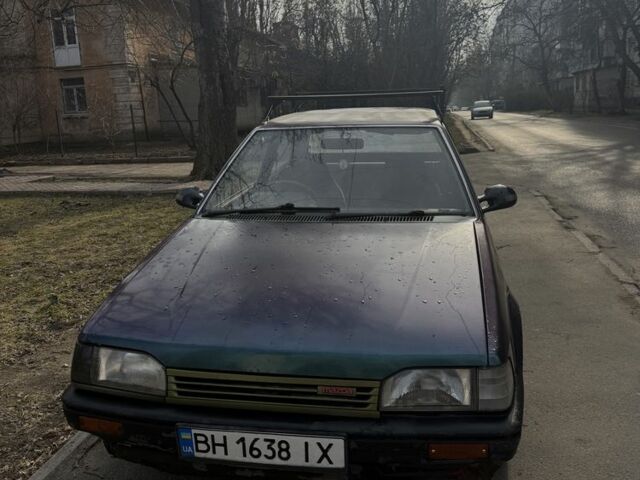 Зеленый Мазда 323, объемом двигателя 1.3 л и пробегом 176 тыс. км за 750 $, фото 1 на Automoto.ua