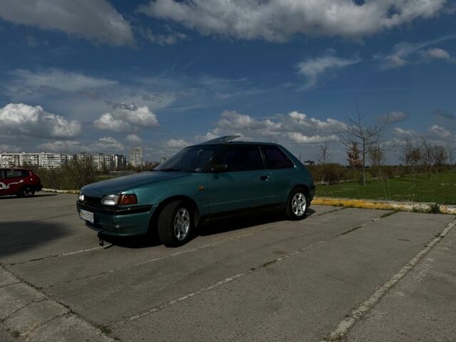 Зеленый Мазда 323, объемом двигателя 1.3 л и пробегом 380 тыс. км за 1100 $, фото 1 на Automoto.ua