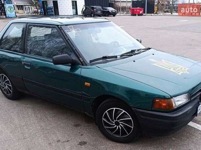 Зеленый Мазда 323, объемом двигателя 1.3 л и пробегом 418 тыс. км за 2200 $, фото 1 на Automoto.ua