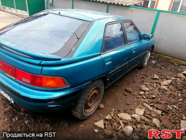 Зеленый Мазда 323, объемом двигателя 1.6 л и пробегом 200 тыс. км за 1500 $, фото 1 на Automoto.ua