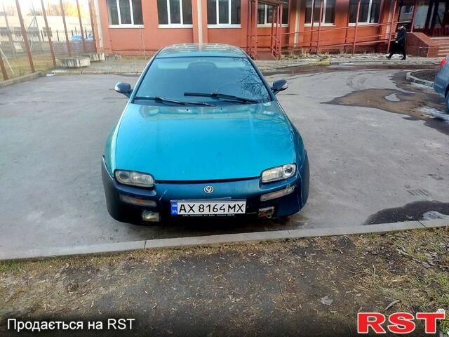 Зеленый Мазда 323, объемом двигателя 1.5 л и пробегом 365 тыс. км за 1800 $, фото 1 на Automoto.ua