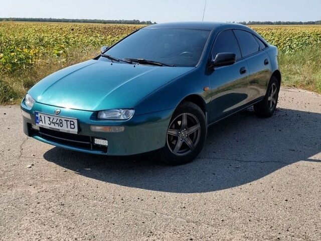 Зелений Мазда 323, об'ємом двигуна 1.5 л та пробігом 300 тис. км за 2600 $, фото 1 на Automoto.ua