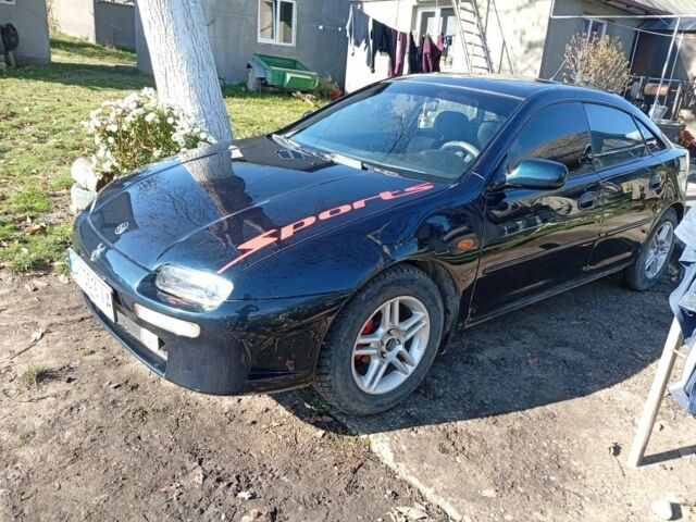 Зеленый Мазда 323, объемом двигателя 1.5 л и пробегом 227 тыс. км за 2500 $, фото 1 на Automoto.ua