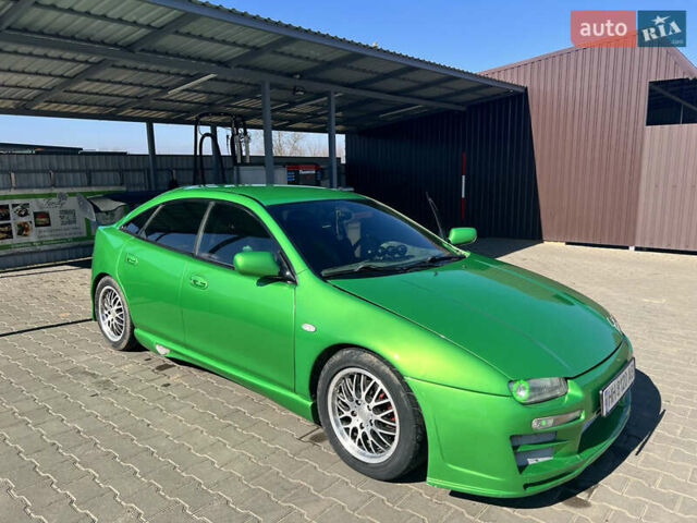 Зеленый Мазда 323, объемом двигателя 2 л и пробегом 200 тыс. км за 4200 $, фото 1 на Automoto.ua