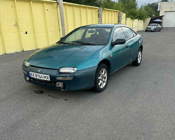 Зеленый Мазда 323, объемом двигателя 1.5 л и пробегом 250 тыс. км за 850 $, фото 1 на Automoto.ua
