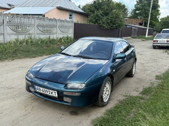 Зеленый Мазда 323, объемом двигателя 2 л и пробегом 300 тыс. км за 2200 $, фото 1 на Automoto.ua