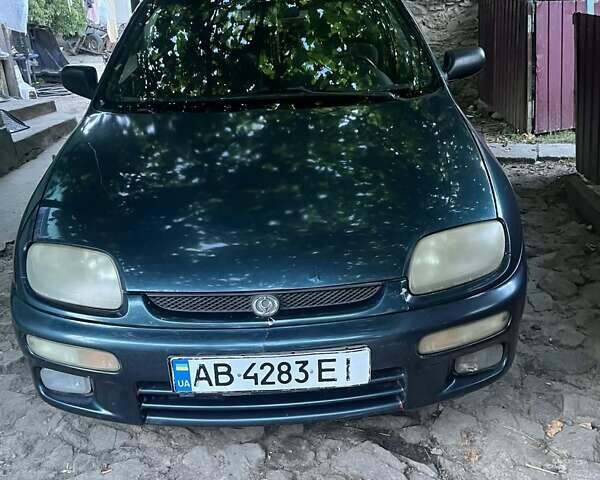 Зеленый Мазда 323, объемом двигателя 1.8 л и пробегом 250 тыс. км за 1950 $, фото 1 на Automoto.ua