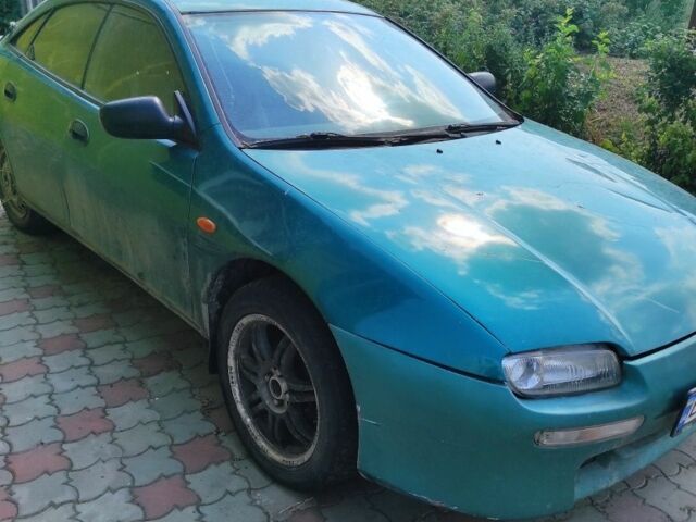 Зеленый Мазда 323, объемом двигателя 1.5 л и пробегом 1 тыс. км за 500 $, фото 1 на Automoto.ua