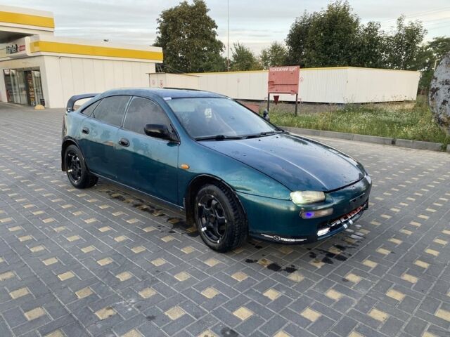 Зеленый Мазда 323, объемом двигателя 1.5 л и пробегом 222 тыс. км за 1200 $, фото 1 на Automoto.ua