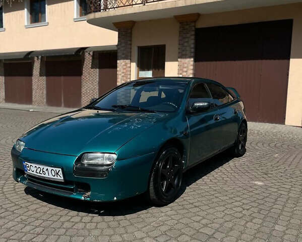 Зеленый Мазда 323, объемом двигателя 1.5 л и пробегом 250 тыс. км за 2000 $, фото 1 на Automoto.ua
