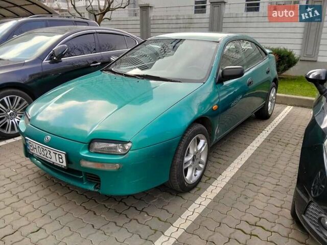 Зеленый Мазда 323, объемом двигателя 1.8 л и пробегом 161 тыс. км за 3200 $, фото 1 на Automoto.ua