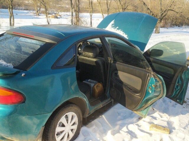 Зеленый Мазда 323, объемом двигателя 2 л и пробегом 30 тыс. км за 1200 $, фото 1 на Automoto.ua