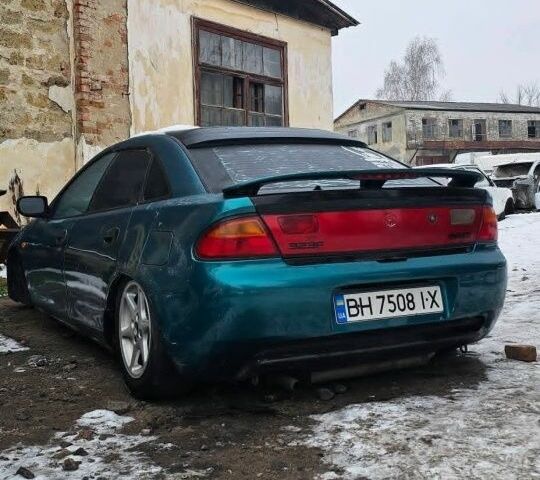 Зеленый Мазда 323, объемом двигателя 1.8 л и пробегом 250 тыс. км за 789 $, фото 1 на Automoto.ua