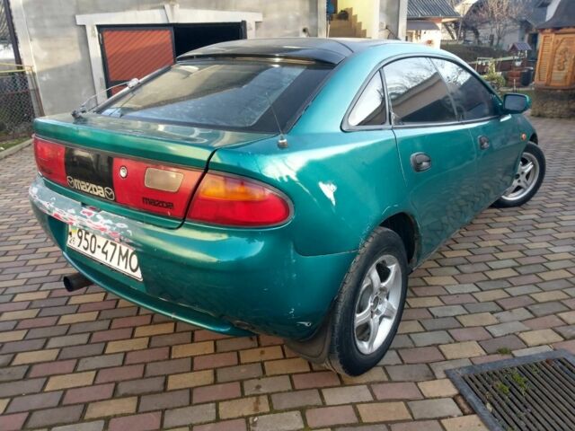 Зеленый Мазда 323, объемом двигателя 1.5 л и пробегом 100 тыс. км за 1350 $, фото 1 на Automoto.ua