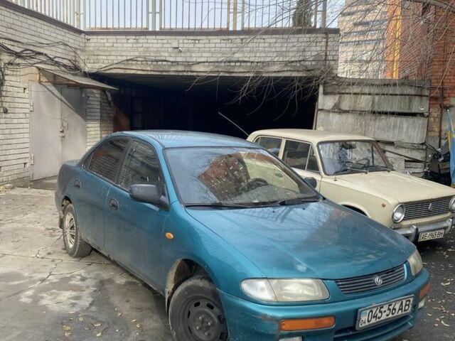 Зеленый Мазда 323, объемом двигателя 1.5 л и пробегом 424 тыс. км за 1500 $, фото 1 на Automoto.ua