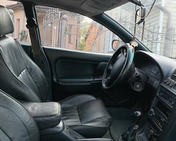 Зеленый Мазда 323, объемом двигателя 1.49 л и пробегом 395 тыс. км за 2700 $, фото 1 на Automoto.ua