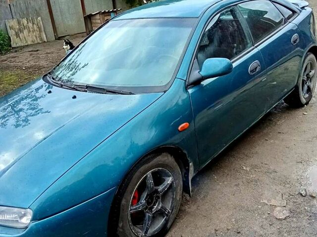 Зеленый Мазда 323, объемом двигателя 1.5 л и пробегом 161 тыс. км за 2100 $, фото 1 на Automoto.ua