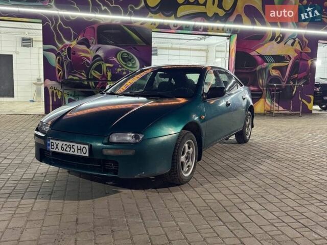Зеленый Мазда 323, объемом двигателя 1.49 л и пробегом 320 тыс. км за 1150 $, фото 1 на Automoto.ua