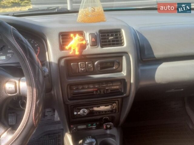 Зеленый Мазда 323, объемом двигателя 1.49 л и пробегом 319 тыс. км за 2600 $, фото 1 на Automoto.ua