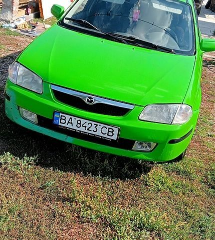 Зелений Мазда 323, об'ємом двигуна 1.3 л та пробігом 254 тис. км за 1900 $, фото 1 на Automoto.ua