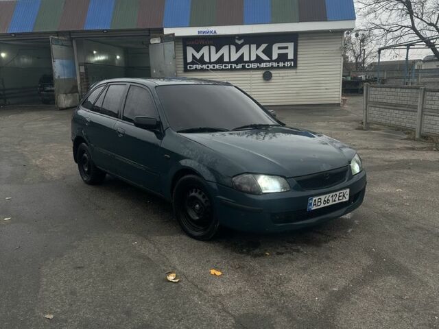 Зеленый Мазда 323, объемом двигателя 1.5 л и пробегом 400 тыс. км за 1500 $, фото 1 на Automoto.ua