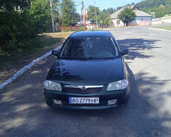 Зеленый Мазда 323, объемом двигателя 1.5 л и пробегом 200 тыс. км за 2800 $, фото 1 на Automoto.ua