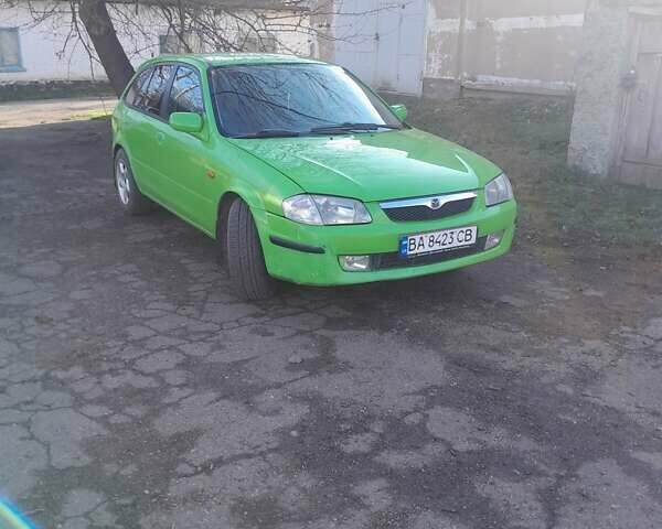 Зелений Мазда 323, об'ємом двигуна 1.3 л та пробігом 254 тис. км за 1900 $, фото 1 на Automoto.ua