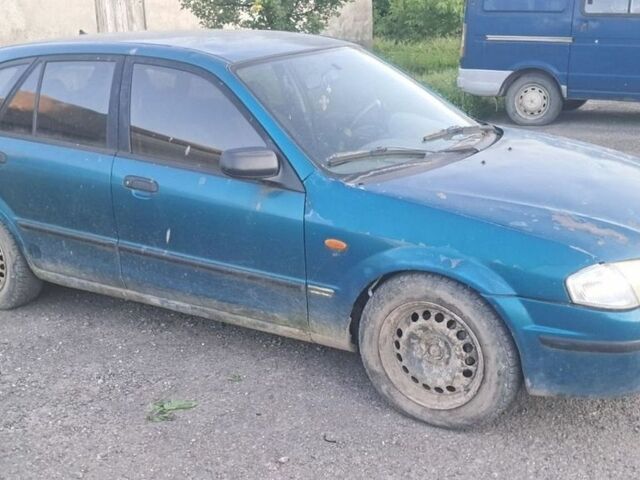 Зеленый Мазда 323, объемом двигателя 1.7 л и пробегом 228 тыс. км за 700 $, фото 1 на Automoto.ua