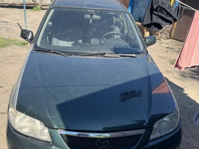 Зелений Мазда 323, об'ємом двигуна 2 л та пробігом 380 тис. км за 2000 $, фото 1 на Automoto.ua