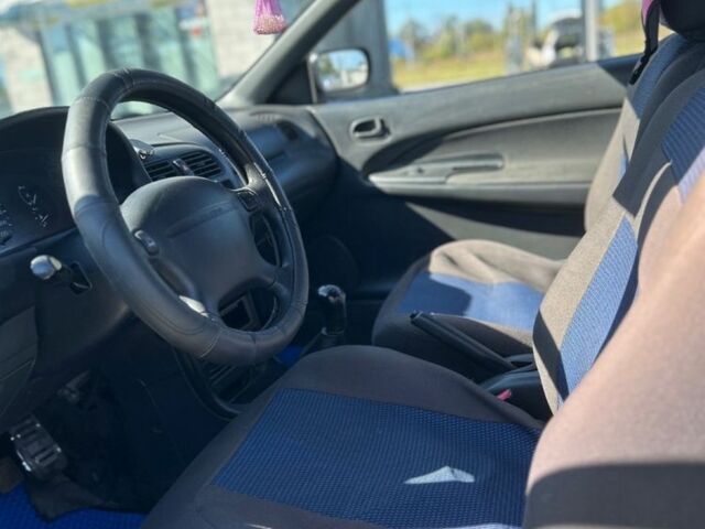 Зеленый Мазда 323, объемом двигателя 1.5 л и пробегом 317 тыс. км за 1300 $, фото 1 на Automoto.ua