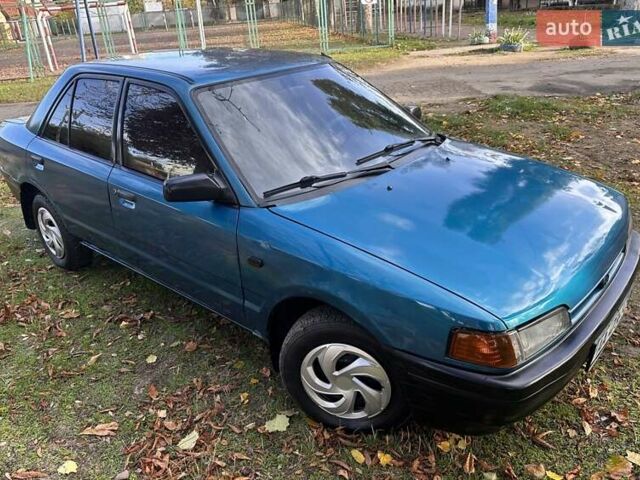 Зеленый Мазда 323, объемом двигателя 1.6 л и пробегом 200 тыс. км за 1000 $, фото 1 на Automoto.ua