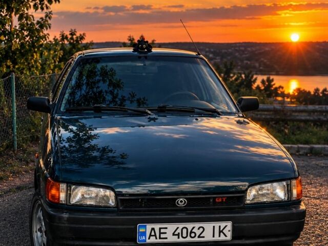 Зелений Мазда 323, об'ємом двигуна 1.7 л та пробігом 300 тис. км за 2005 $, фото 1 на Automoto.ua